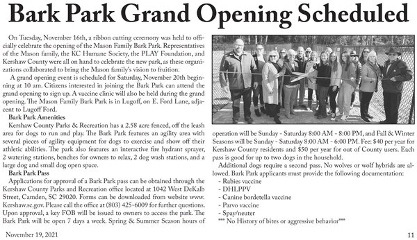 Newspaper clipping headlined Bark Park Grand Opening Scheduled, dated November 19, 2021, with a photo of a group at the park’s ribbon cutting