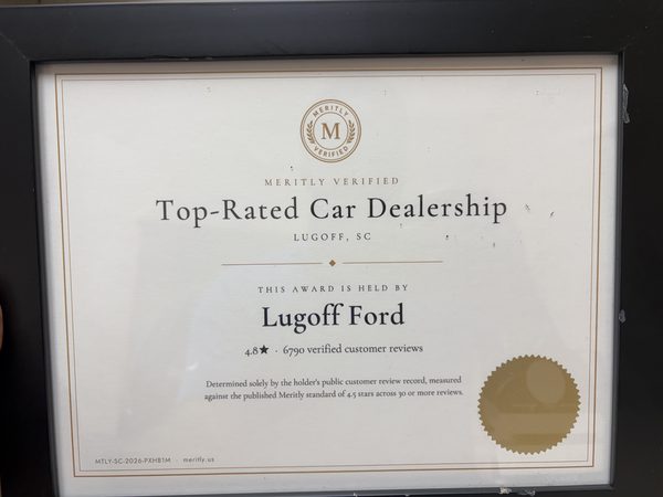 Framed Meritly Verified certificate with a gold seal, reading Top-Rated Car Dealership, Lugoff, SC, this award is held by Lugoff Ford, 4.8 stars, 6,790 verified customer reviews